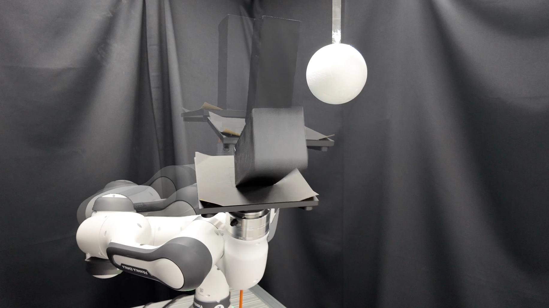 Motion snapshot: the object tips on the tray